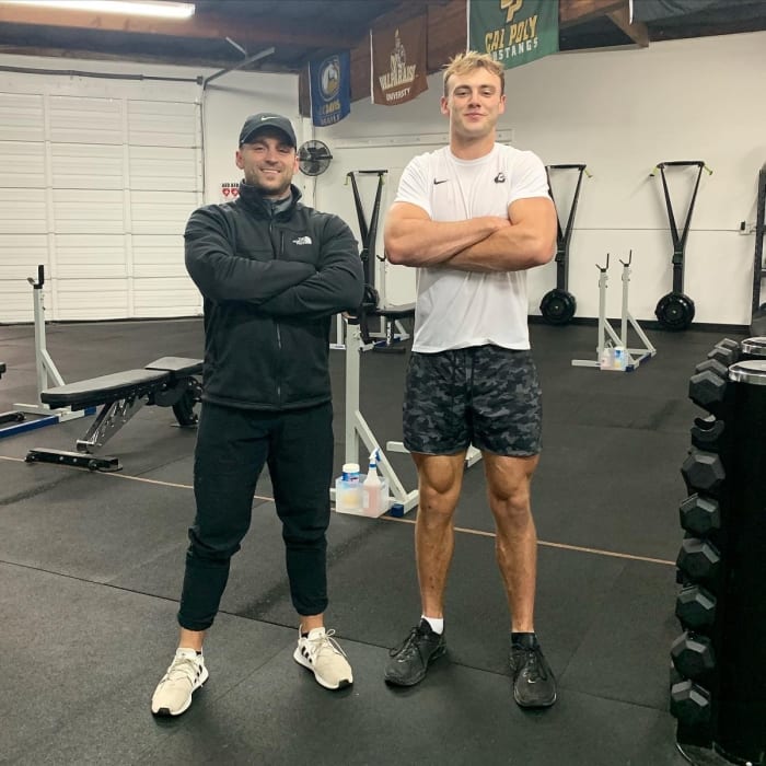 Brock Bowers with his personal trainer John Cortese.